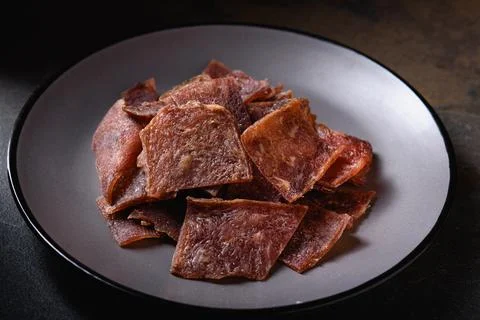 View from Above. Flat Layout. Snack for Beer. Dried Pork Chips with Seasoning Stock Photos