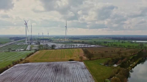 View from above on the German motorway A7 with some windmills for renewable Stock Footage 345759123