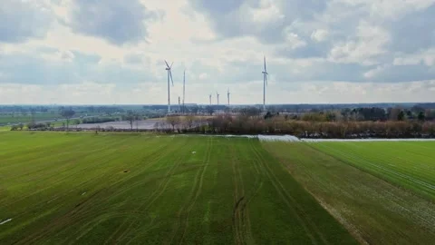 View from above on the German motorway A7 with some windmills for renewable Stock Footage 345761496