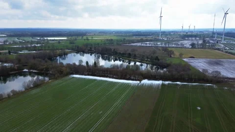 View from above on the German motorway A7 with some windmills for renewable Stock Footage 345761707