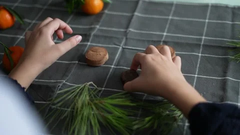 View from above hands decorating the table with typical Christmas sweets made Stock Footage 163827577
