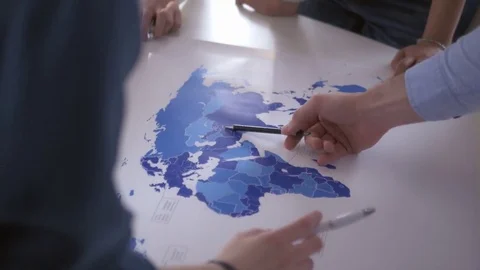 View from above of hands on the world map Stock Footage 75573878