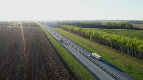 View from above on the highway passing through the suburbs. Truck with semi Stock Footage 154267033