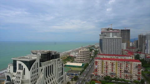 View from above, the hotel is located next to the coast and palm trees Stock-Footage 94140183