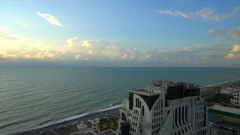 View from above, the hotel is located next to the coast and palm trees Stock Footage 94140782