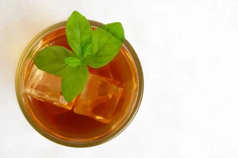 View from above on ice tea,ice cubes,mint on ice on white background Stock Photos