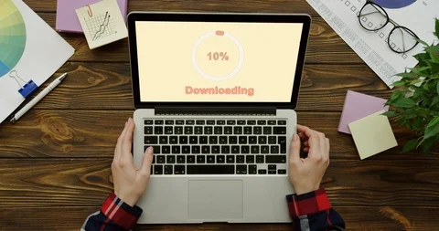 View from above on the laptop processing an installation of the program on the Stock Footage 95051053