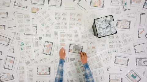 A view from above of a large table that is stuck on a story board sheets. 스톡 동영상 77374362