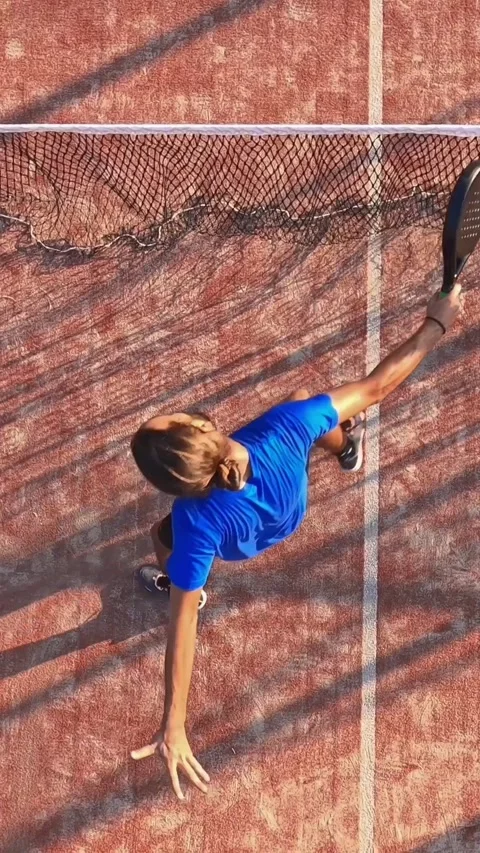 View from above of a man practicing paddle tennis near the net. Stock Footage 310104339