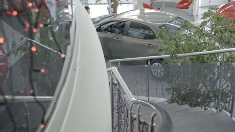 View from above of man sitting in car in auto salon Stock Footage 101113329