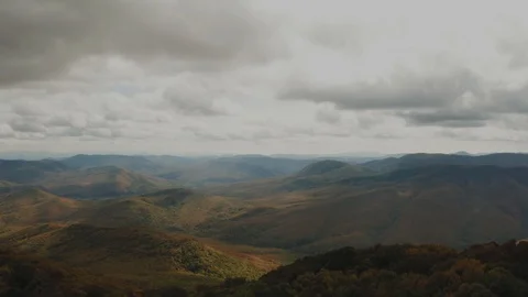 View from Above of Mountain Valley Illuminated by the Rays of the Sun Stock Footage 118464257