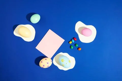 View from above of a note paper with empty space surrounded by lovely Easter  Stock Photos