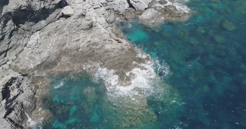 A view from above of the ocean waves crushing on the rocks in South of France Stock Footage 194945212