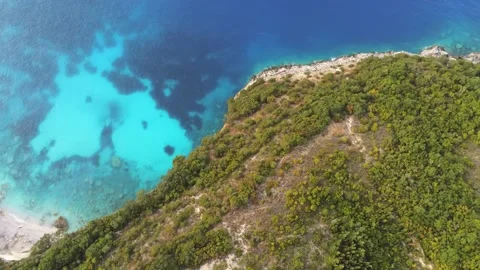 View from above over clear blue waters and green trees Video stock 156271398