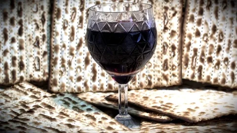 View from above on passover red wine and matzoh, jewish holiday bread. Macro Stock Footage 76246928