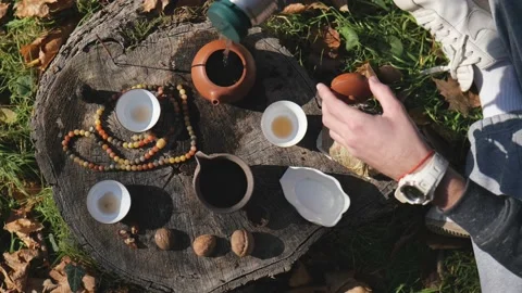 View from above. pouring boiling water from a thermos into a clay teapot Stock Footage 229859457