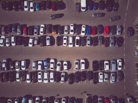 A view from above to the process of car parking. Heavy traffic in the parking Stock Photos