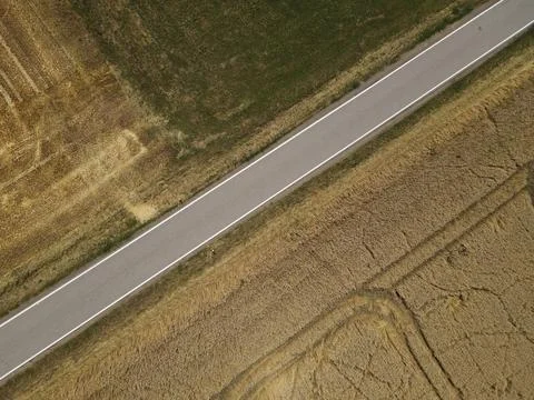 View from above of a road between fields in the countryside Stock Photos