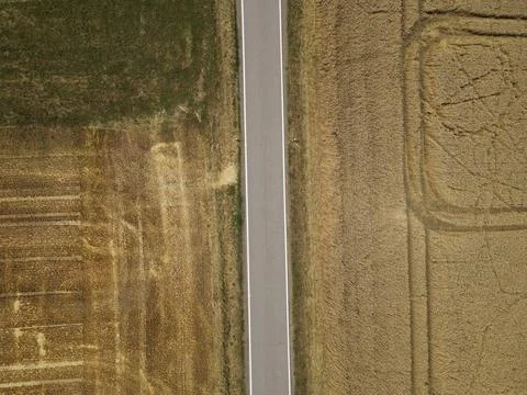 View from above of a road between fields in the countryside Stock Photos