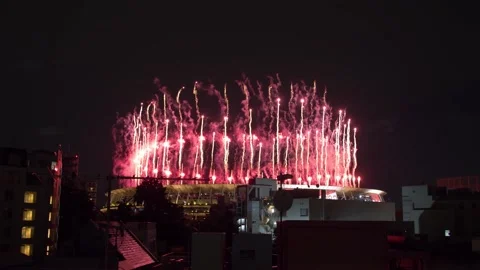 View above rooftops of the Tokyo 2020 Olympics National Stadium opening Stock Footage 157815983
