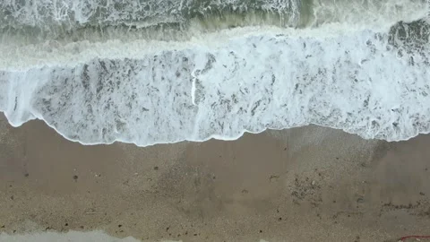 View from above on the sandy shoreline washes by sea waves Stock Footage 132181560