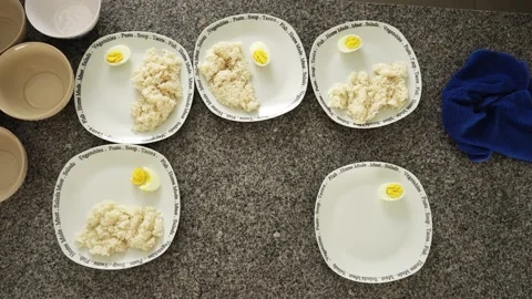 View from above serving food in the kitchen of various dishes with rice and Video stock 189102684