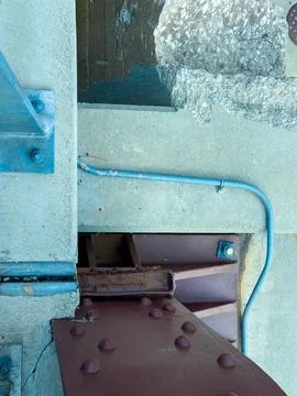 View from above showing a section of blue piping and rust-colored metal sta.. Stock Photos