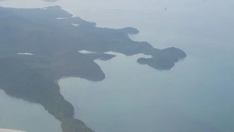 View above the sky while flying over open sea bay coastline with many tropi.. Stock Footage 274485842