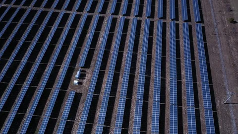 View from above a solar farm. Slow pan across the panels. Stock Footage 119705760