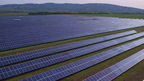 A view from above of solar modules in a solar park. Lower energy costs in the Stock Footage 156463108