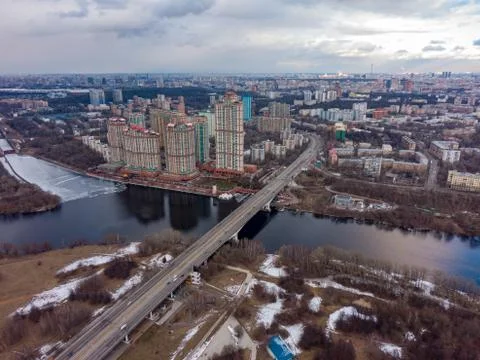 The view from above of the spring city, in the frame is ice on the river, high Stock Photos