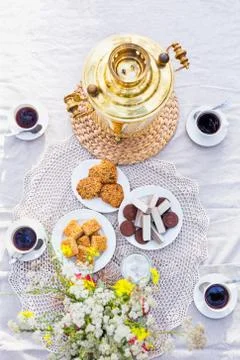 View from above on table with samovar, coffee cups, sweets Stock Photos
