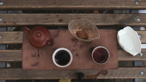 View from above. tea accessories for the tea ceremony. glass cup. tea bowls Stock Footage 229860778
