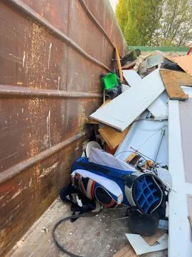 View from above at the throw away golf club bag in dumpster- recycling old 스톡 사진