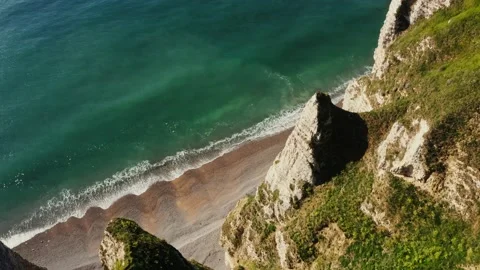 View from above from the top of a cliff with sharp peaks to the seashore Stock Footage 205536612