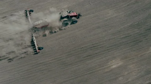 View from above, tractor working in a field. Dust wall. Stock Footage 134033917