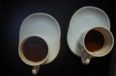 A view from above of two cups of hot coffee Stock Photos