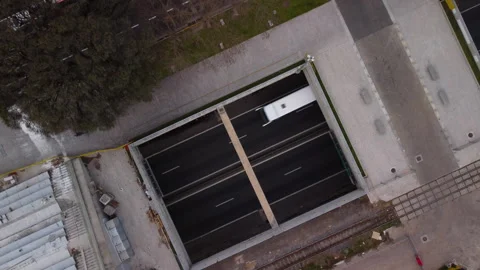 View from above, underground road parallel to the surface road, cars driving Stock Footage 250325594