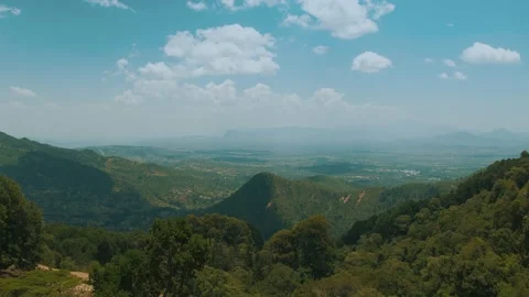 View from above of valley with settlements surrounded by chains of mountains Vidéo 310517559