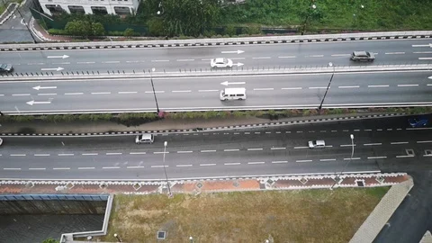 View from above, various vehicles pass through the road during the rains Stock Footage 123883815