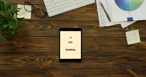 View from above on the vertical black tablet device on white screen of which Stock Footage 95098597