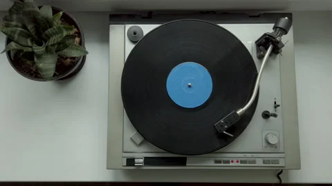 View from above on vintage vinyl record spinning on old vinyl record player Stock Footage
