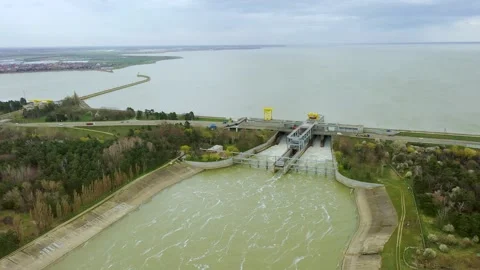 View from above of the water rushing through the gates of the dam at the Stock Footage 185041578