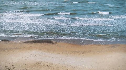 View from above of wave splashes on the beach coast Stock Footage 83456329