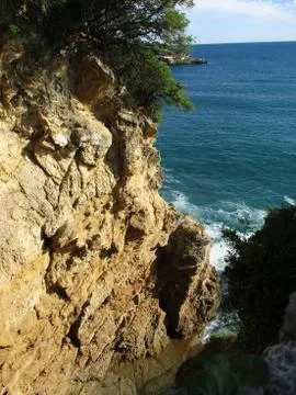 View from above of the waves on the rocks h Stock Photos