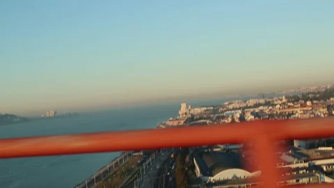 View from above when riding on the bridge on the water surface and embankment Stock Footage 130115956