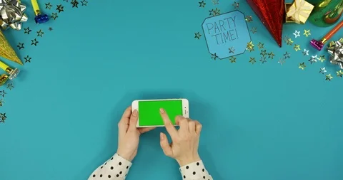 View from above on the white horizontal smartphone lying on the blue table with 스톡 동영상 89315810