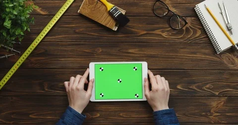 View from above on the white horizontal tablet device on the wooden desk with 스톡 동영상 96021590