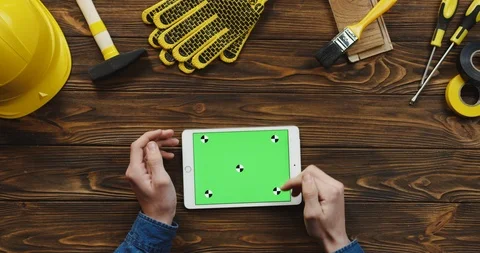 View from above on the white horizontal tablet device on the wooden desk of 스톡 동영상 96182377