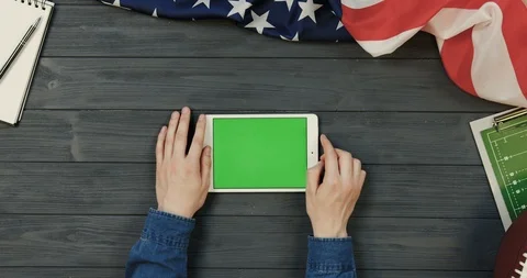 View from above on the white tablet computer lying horizontally on the dark grey Stock-Footage 96337972